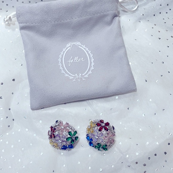 Lovely dome shaped earrings with multi colored glittering cubic zirconia stones.